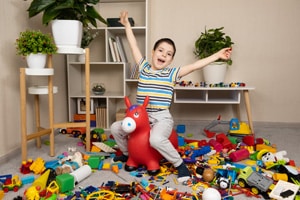 little-boy-is-jumping-inflatable-rubber-donkey-mess-children-s-room - Crossroads Family Therapy little-boy-is-jumping-inflatable-rubber-donkey-mess-children-s-room